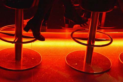 bar stool person sitting on bar stool chair